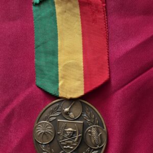 Republic of Zaire Medal for Agricultural Merit with a green, yellow, and red ribbon.