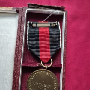 A German 1938 Sudetenland annexation commemorative medal in a presentation box.