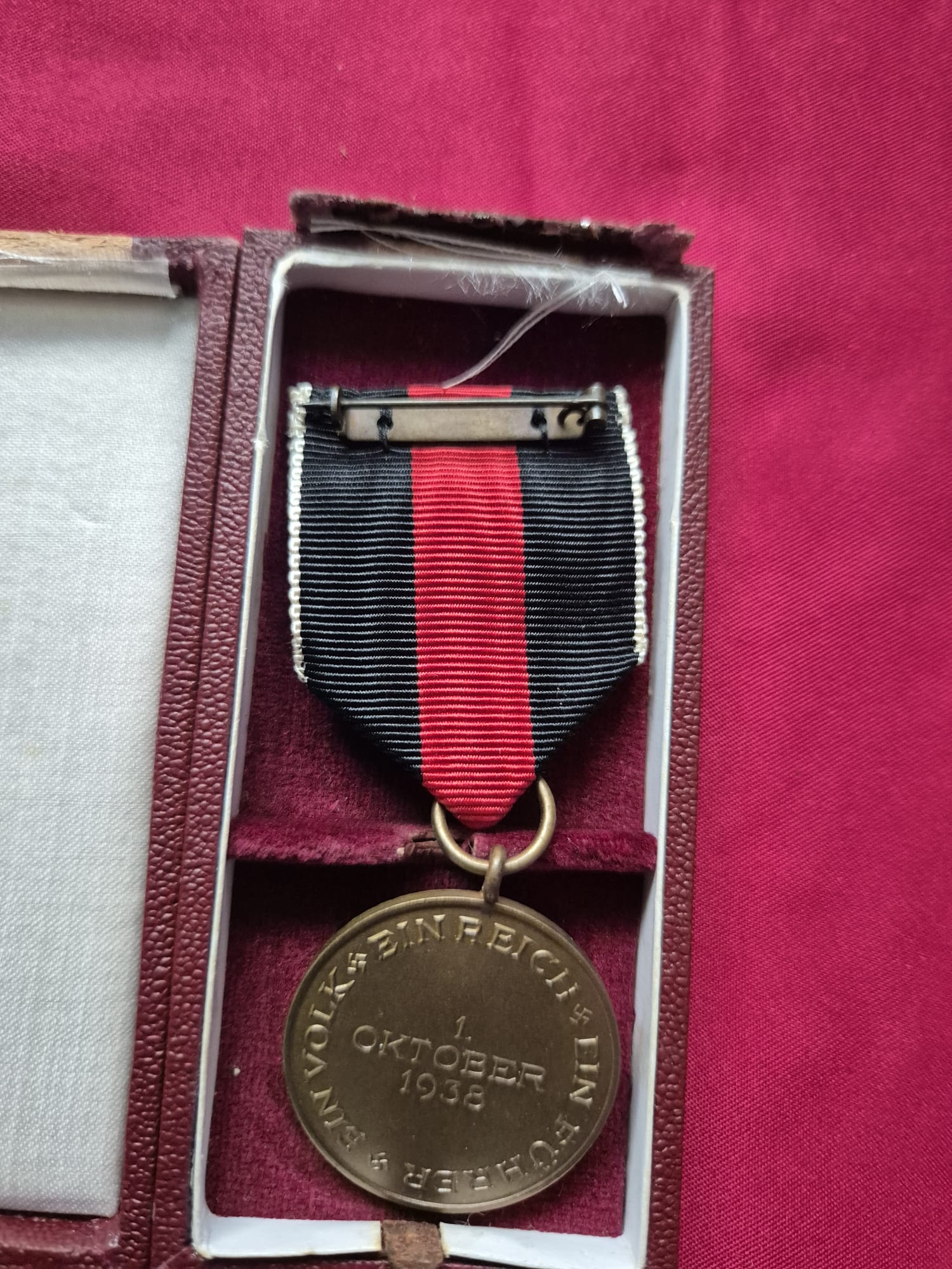A German 1938 Sudetenland annexation commemorative medal in a presentation box.