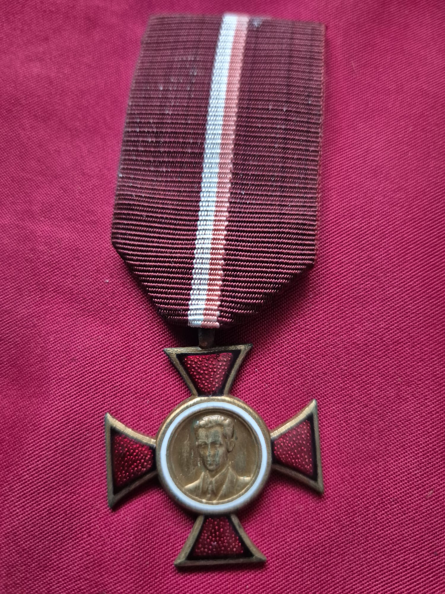A Polish Cross of Janek Krasicki medal with ribbon.