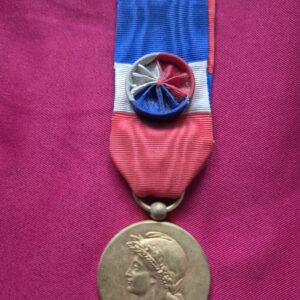 French Medal of Honor for Labor with tricolor ribbon and rosette.