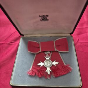 Member of the Order of the British Empire (MBE), ladies, in the Royal Mint case of issue, together with another Order of the British Empire (unboxed).