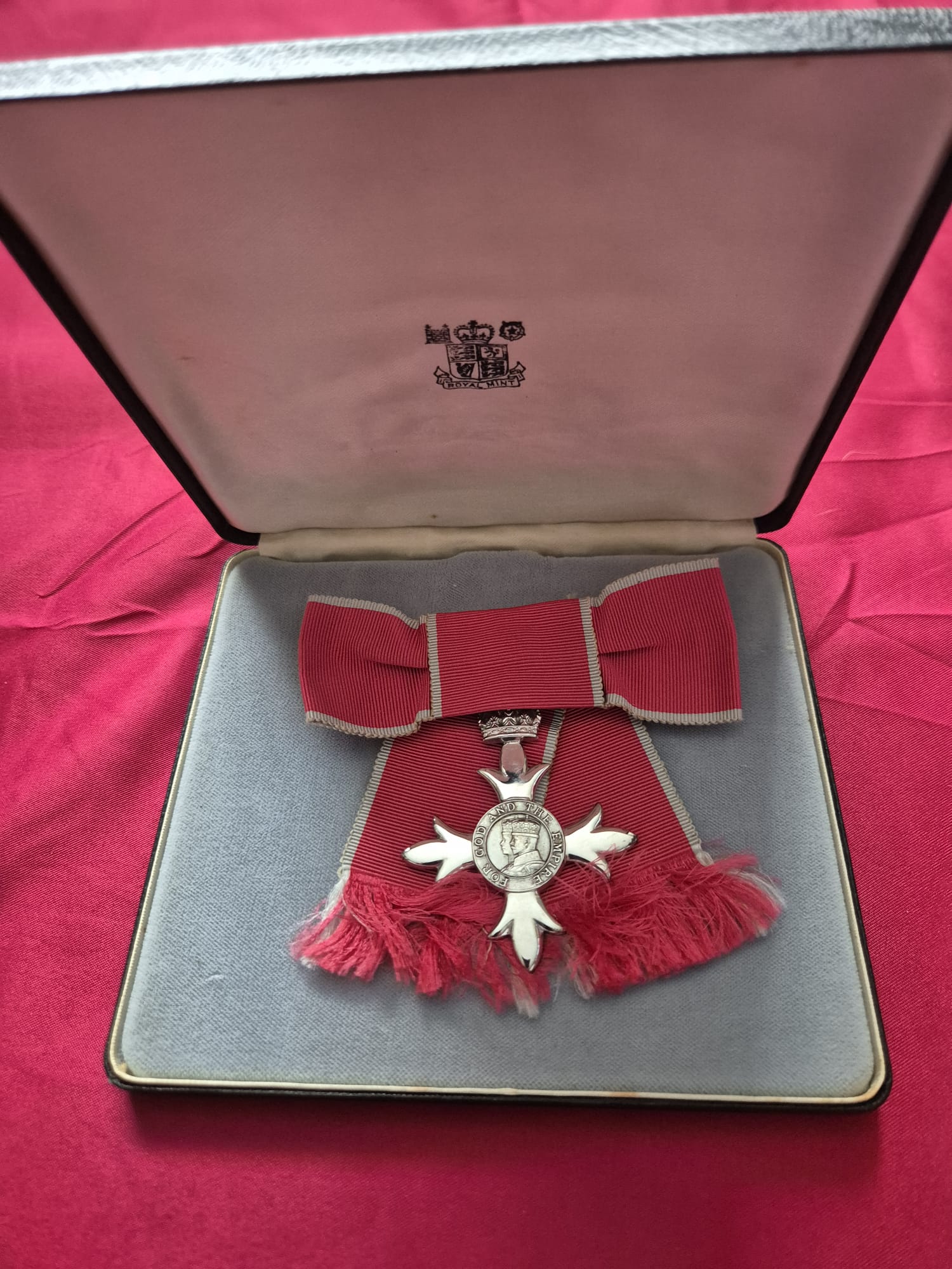 Member of the Order of the British Empire (MBE), ladies, in the Royal Mint case of issue, together with another Order of the British Empire (unboxed).