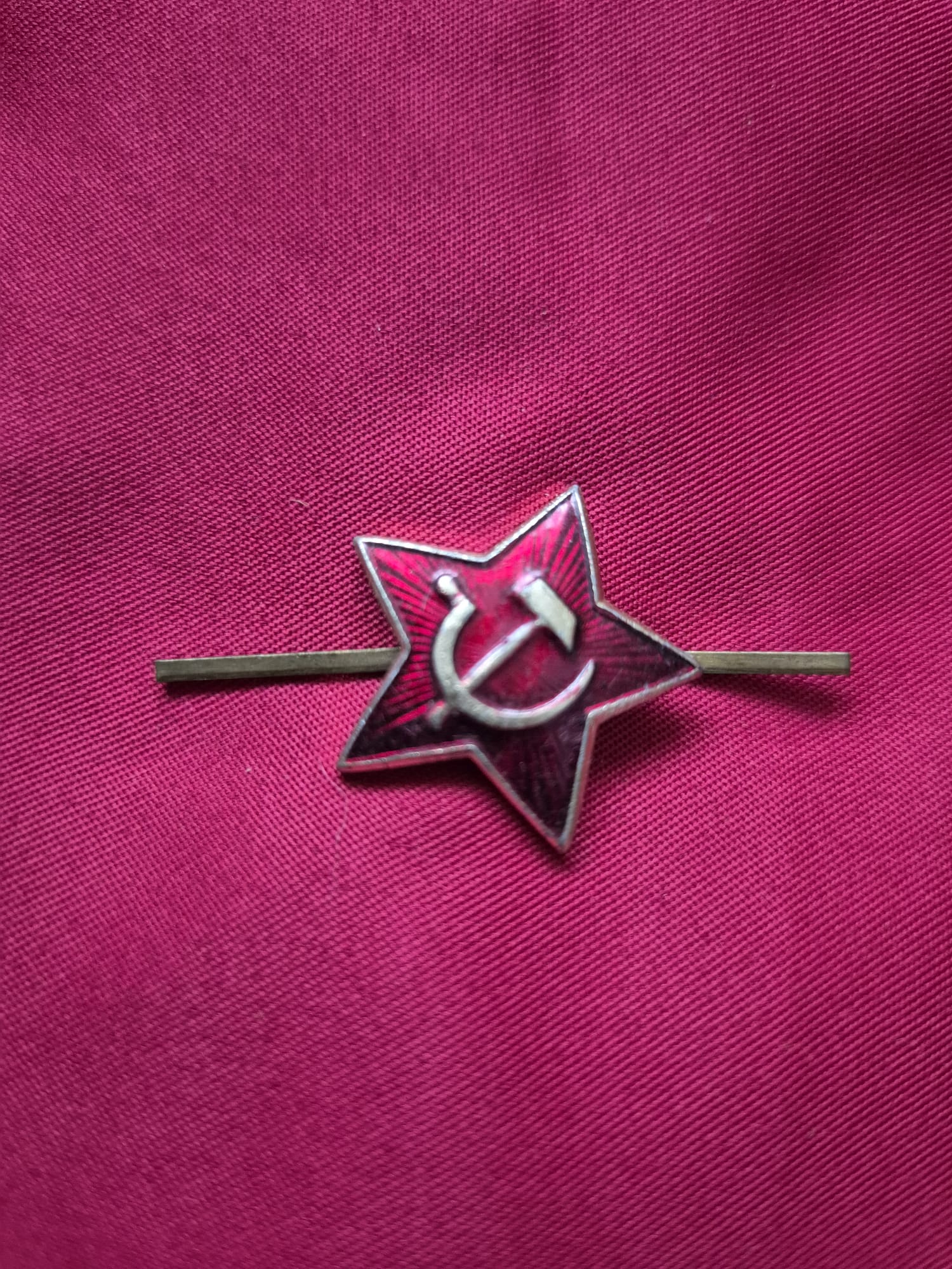 Vintage Soviet Red Army enamel hat badge with hammer and sickle.